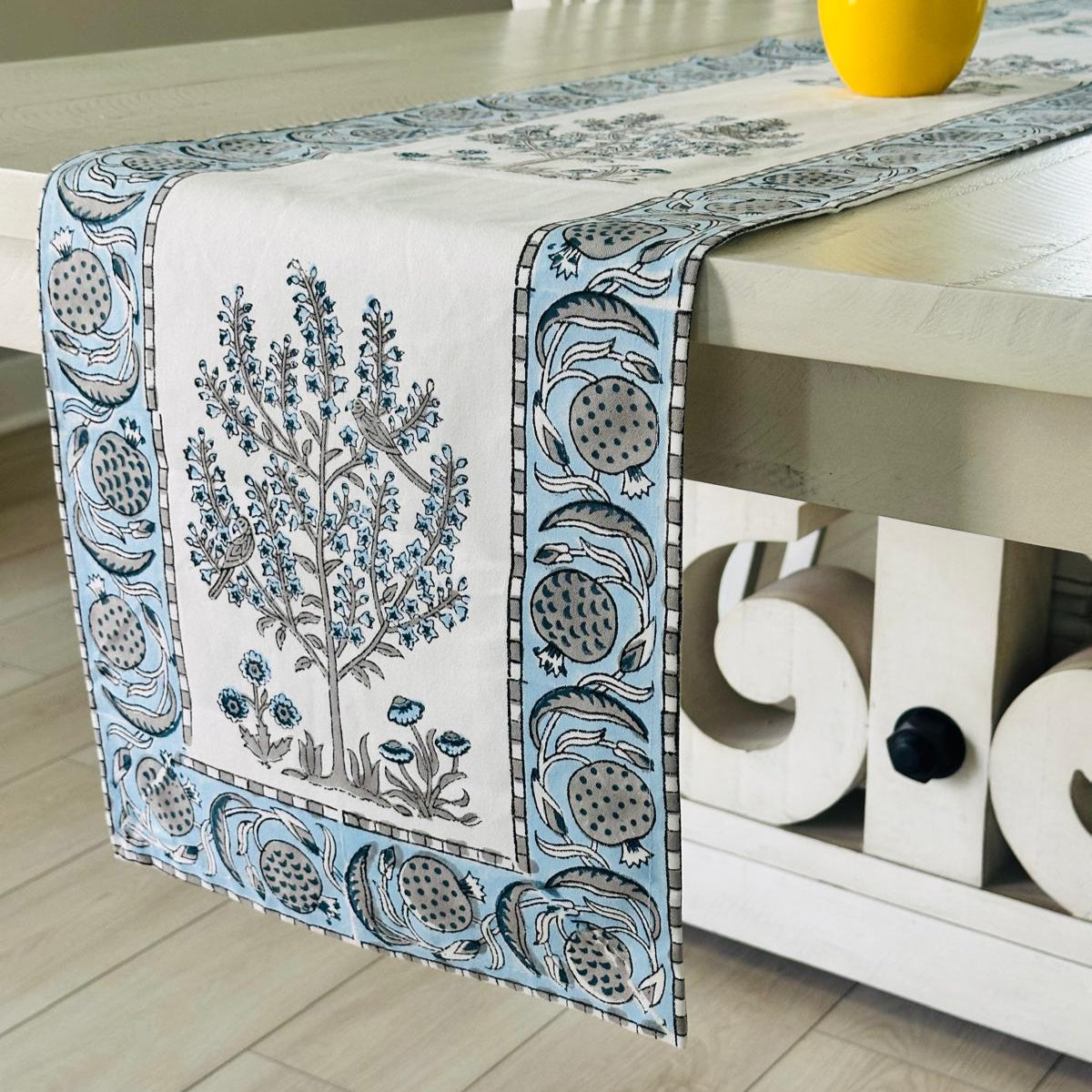 Decorative table runner with floral design on a table