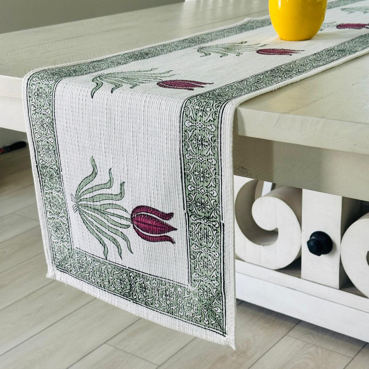 Decorative table runner with floral design on a table