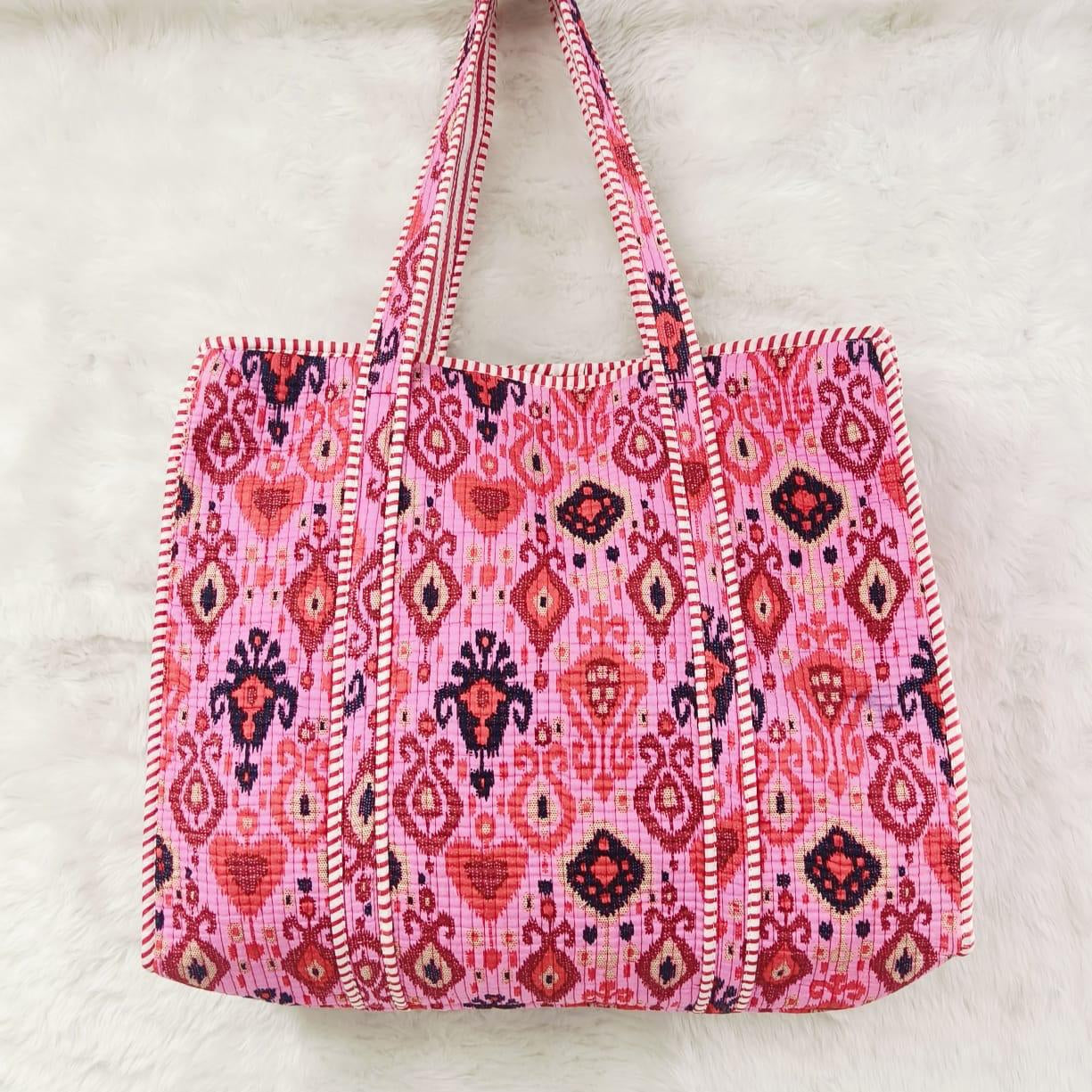 Pink patterned tote bag on a white background