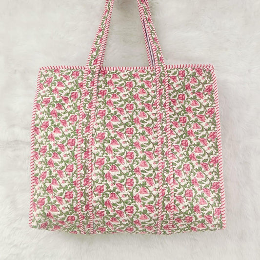 Floral patterned tote bag with pink and green design on a light gray background