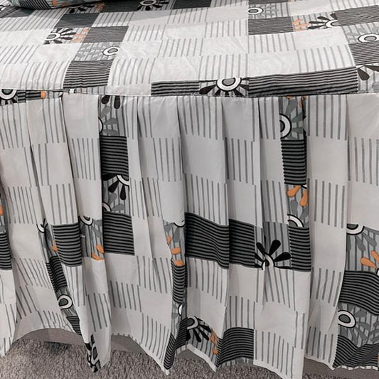 Bedspread with geometric pattern on a bed