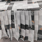 Bedspread with geometric pattern on a bed