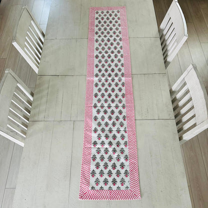 Table runner with a pattern on a wooden table