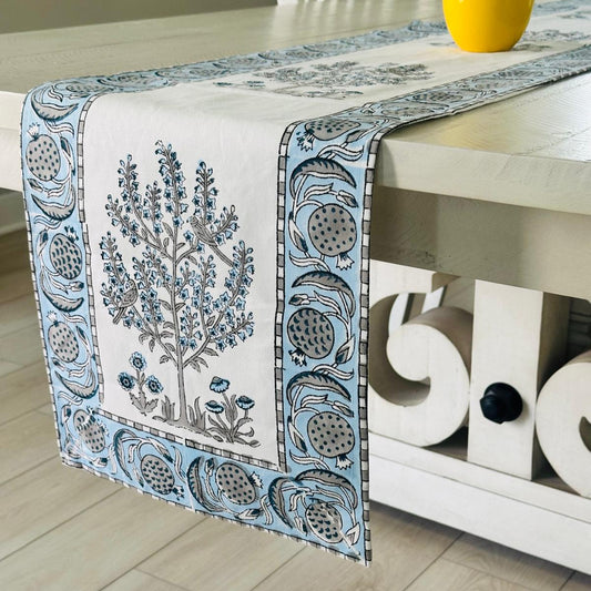Decorative table runner with floral design on a table