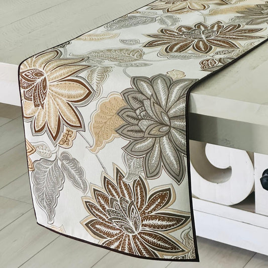 Floral patterned table runner on a table with a neutral background