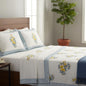 Bedroom with floral-patterned bedding and pillows