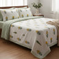 Bed with floral-patterned bedding in a bright bedroom