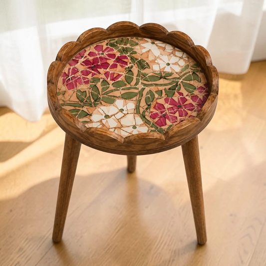 Mosaic-style pink and white floral side table with scalloped rim and three legs