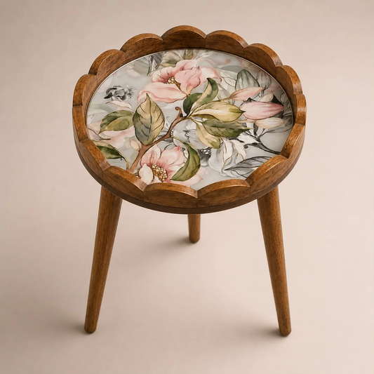 Pink floral side table with scalloped rim and three legs